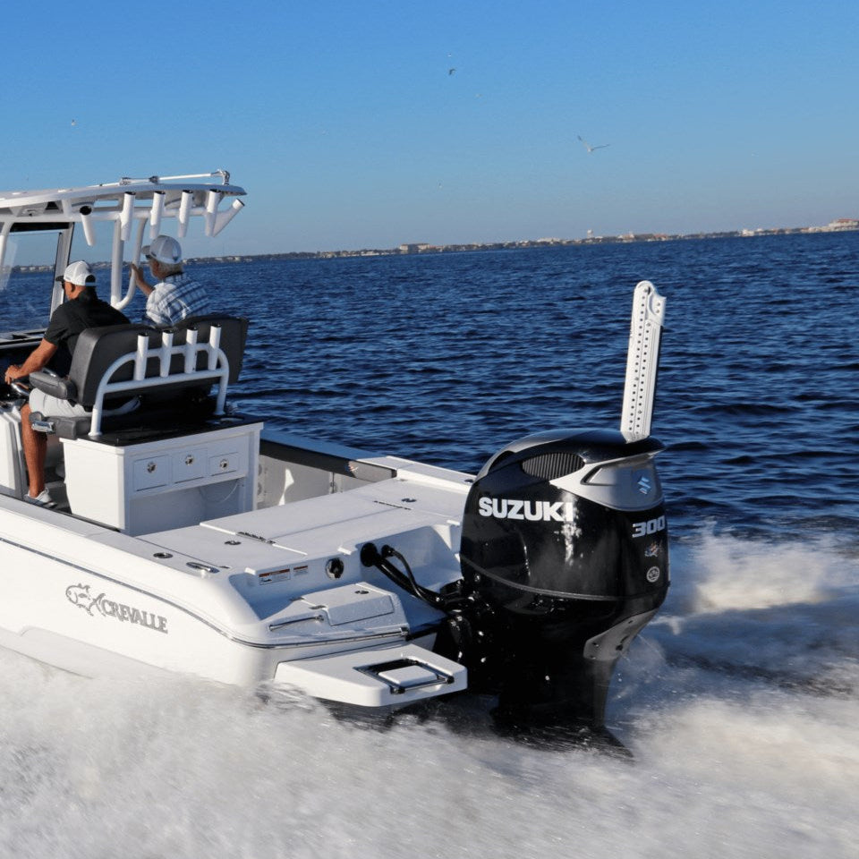 A Suzuki outboard engine on a white center console boat in open water