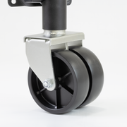 Close up of black Sierra dual trailer jack wheels on a white background