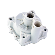 A white plastic pump housing component with multiple cylindrical ports and mounting tabs, shown on a clean white background.