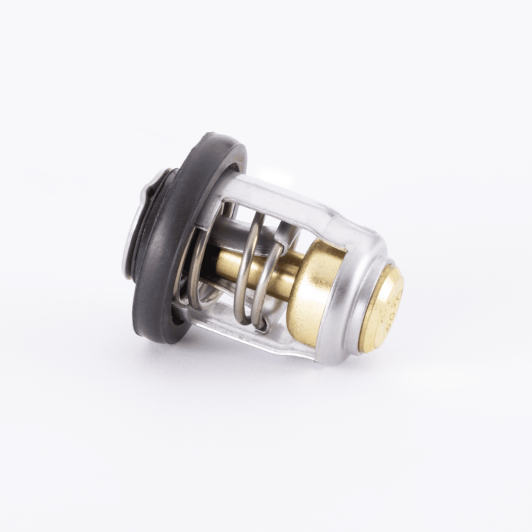 Close-up of a thermostat laying on its side on a white background