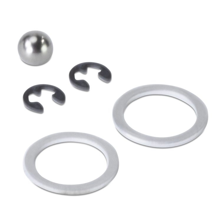 Set of metal washers and a ball on a white background