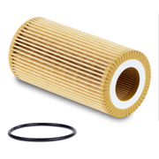 A tan colored oil filter laying on its side next to an o-ring on a white background
