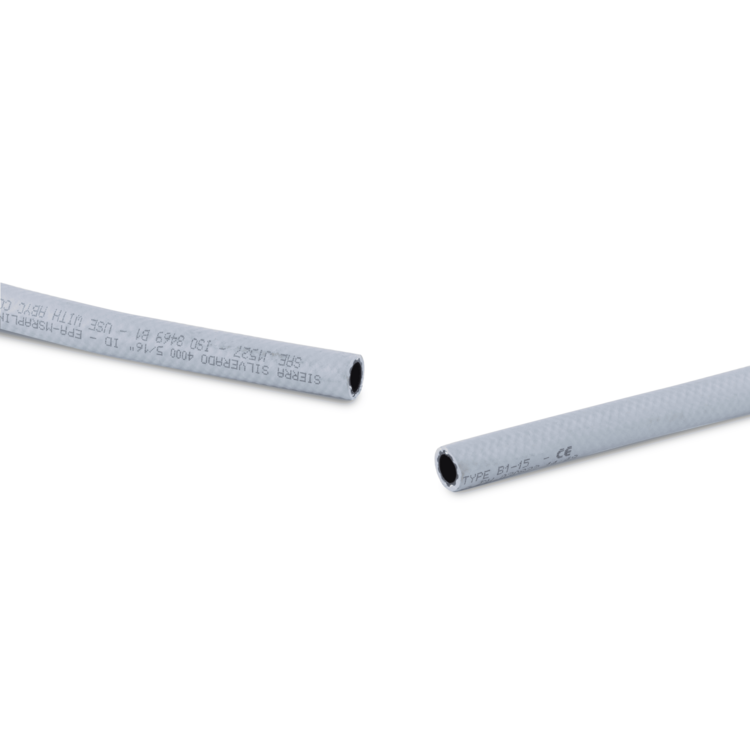 Two ends of a gray fuel line hose on a white background