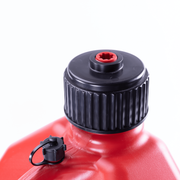 Close-up of a red container with a black cap on a white background