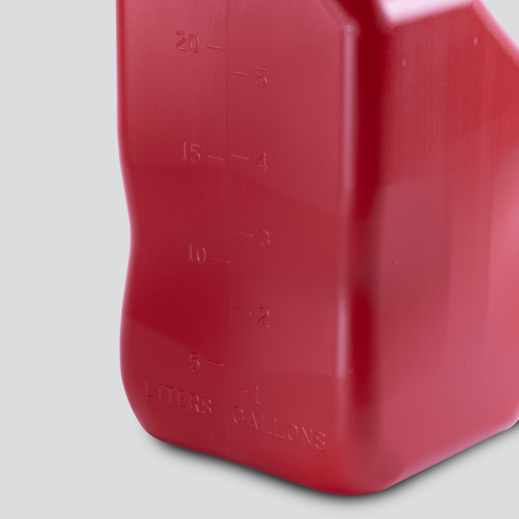 Red plastic container with measurement markings on a gray background