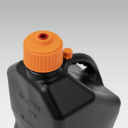 Black VP Racing container with an orange cap on a gray background