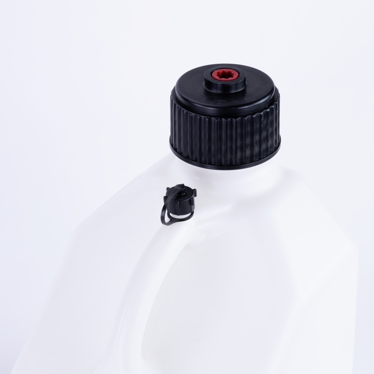 Close-up of a white container with a black cap on a white background