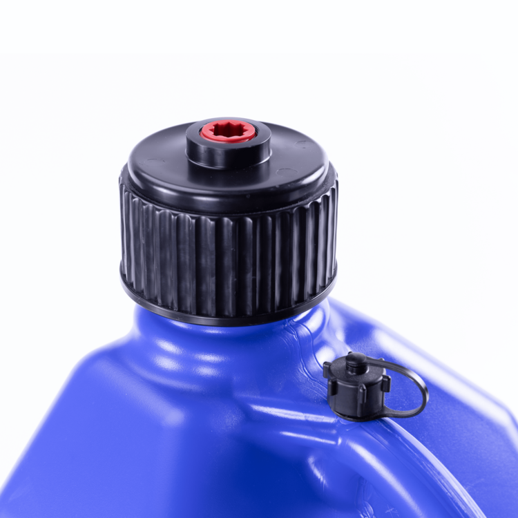 Close-up of a blue plastic container with a black cap on a white background