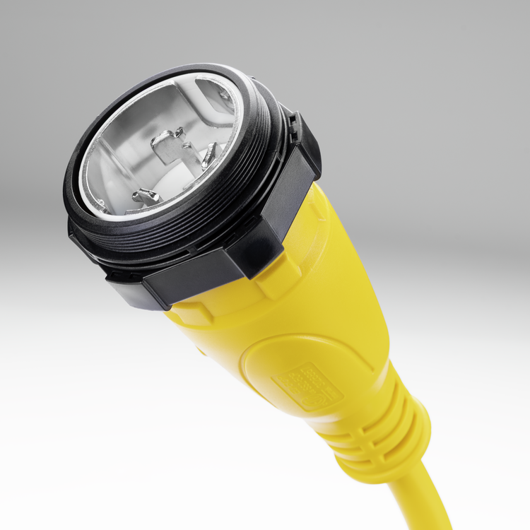 Closeup view of a Sierra shore power pigtail adapter on a white and gray background