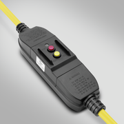 Black electrical plug with yellow cable on a light gray background