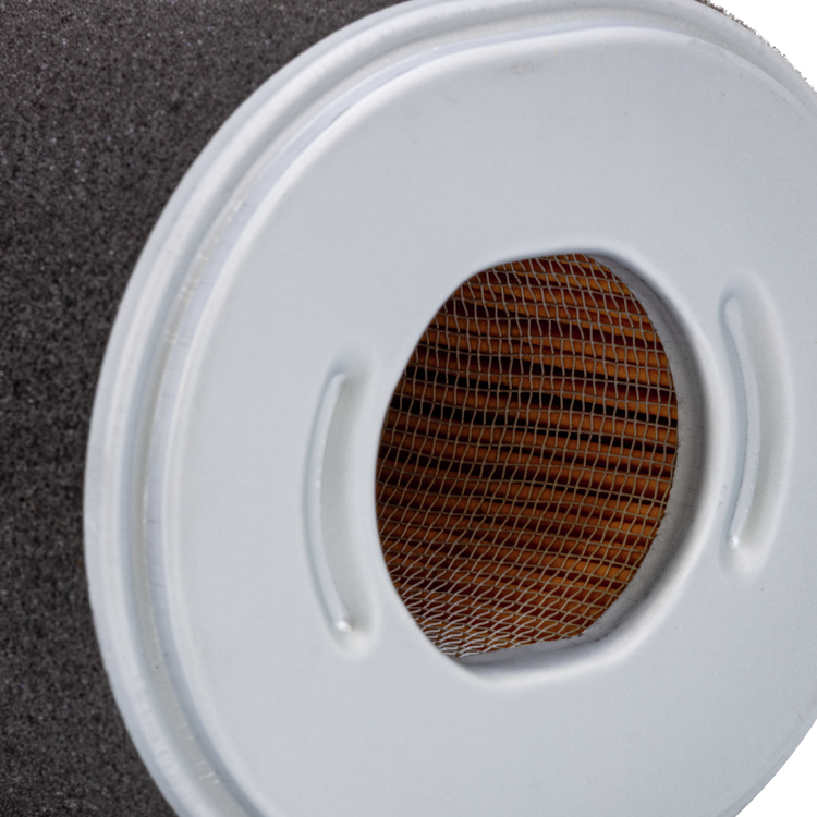 Close-up of a round Prime Line air filter on a white background