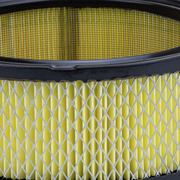 Close-up of a yellow Prime Line air filter on a white background
