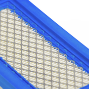Close-up of a blue air filter with a white grid pattern on a white background