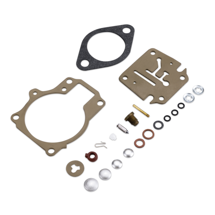 A complete engine gasket and seal kit laid out on a clean white background, including two large gaskets, a metal plate, O-rings, washers, seals, and small hardware.