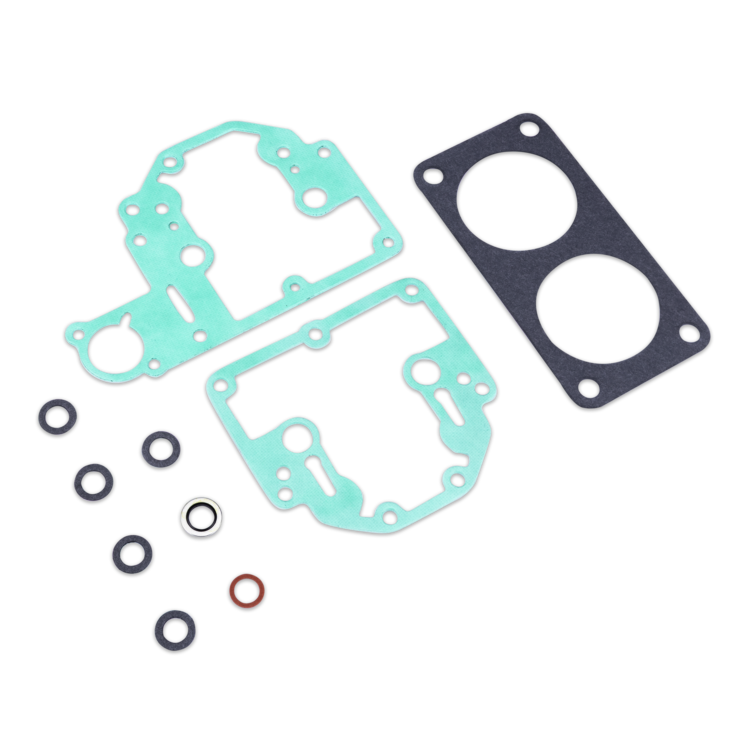 A gasket kit laid out on a white background, including two large mint green gaskets, one large black gasket, several black O-rings, a small silver ring, and a small red ring.