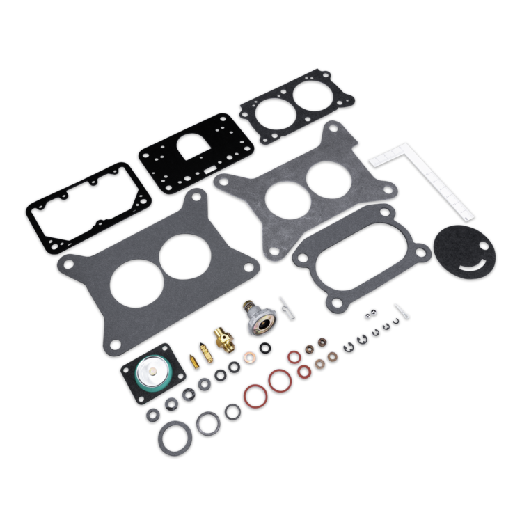 A set of engine gaskets and small hardware parts arranged on a plain white background. The kit includes several black and dark gray gasket sheets, multiple O-rings in black, gray, and red, brass and silver metal components, washers, and a small white plastic piece.