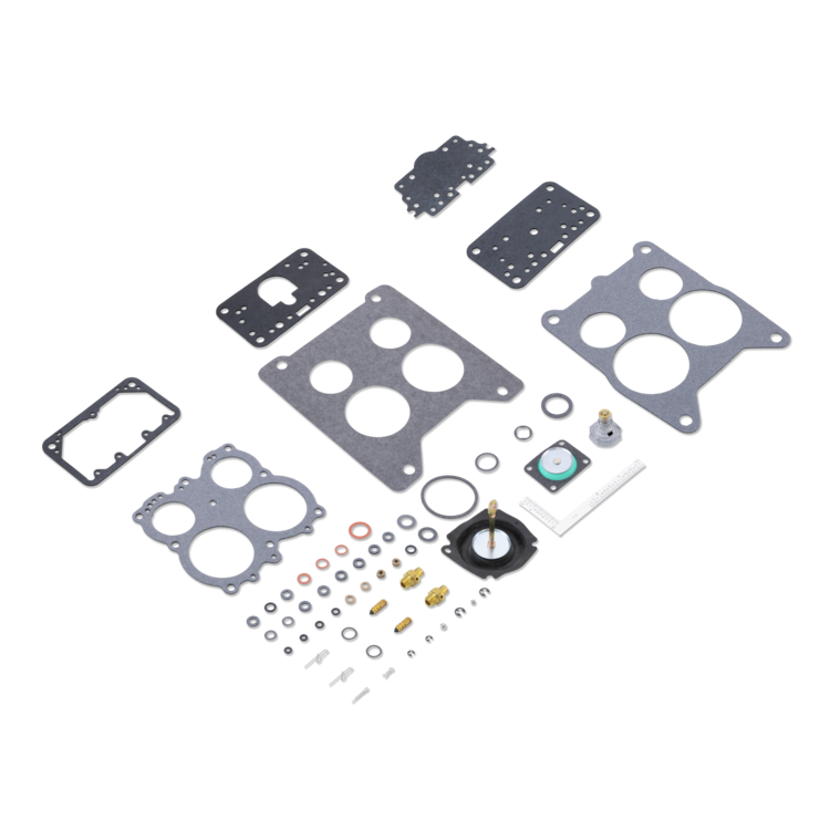 A complete engine gasket and seal kit laid out on a white background, including multiple black and gray gaskets, various rubber O-rings, washers, and small metal hardware.