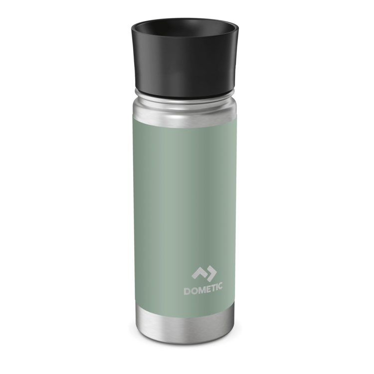 Green Dometic tumbler with black lid on a white background