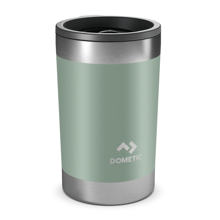 Green insulated Dometic tumbler with silver lid on a white background