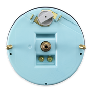 The underside of a circular speedometer, showing brass-colored metal terminals, a central post, and a white plastic component near the top, isolated on a white background.