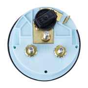 Close-up of a trim gauge with a light blue background