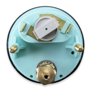 A circular light blue plastic appliance component with brass metal fittings and a white plastic dial, shown against a plain white background.