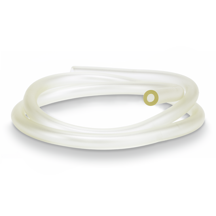 Coil of white silicone tube on a white background