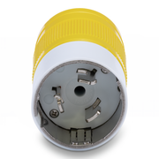 Close-up of a yellow and white electrical plug on a white background