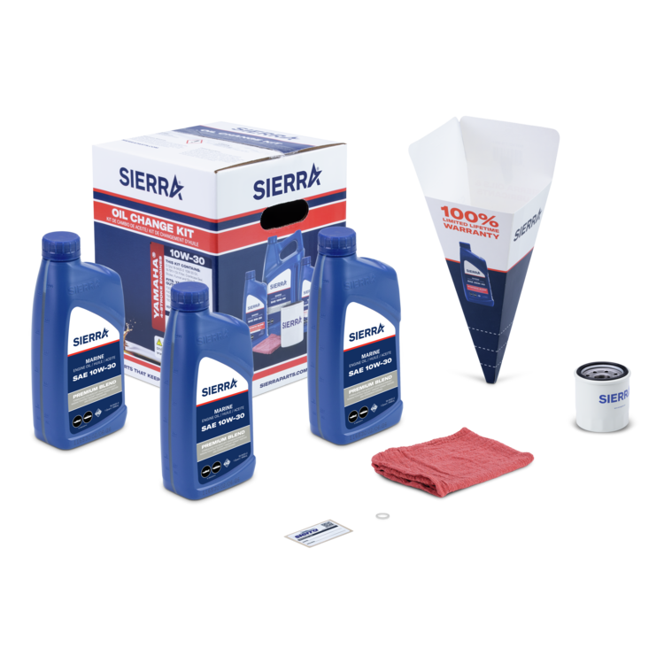 Sierra oil change kit with oil bottles, funnel, and other tools on a white background