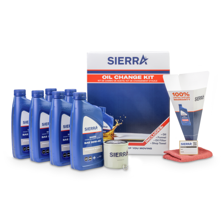 Sierra oil change kit with oil bottles, filter, and other items on a white background