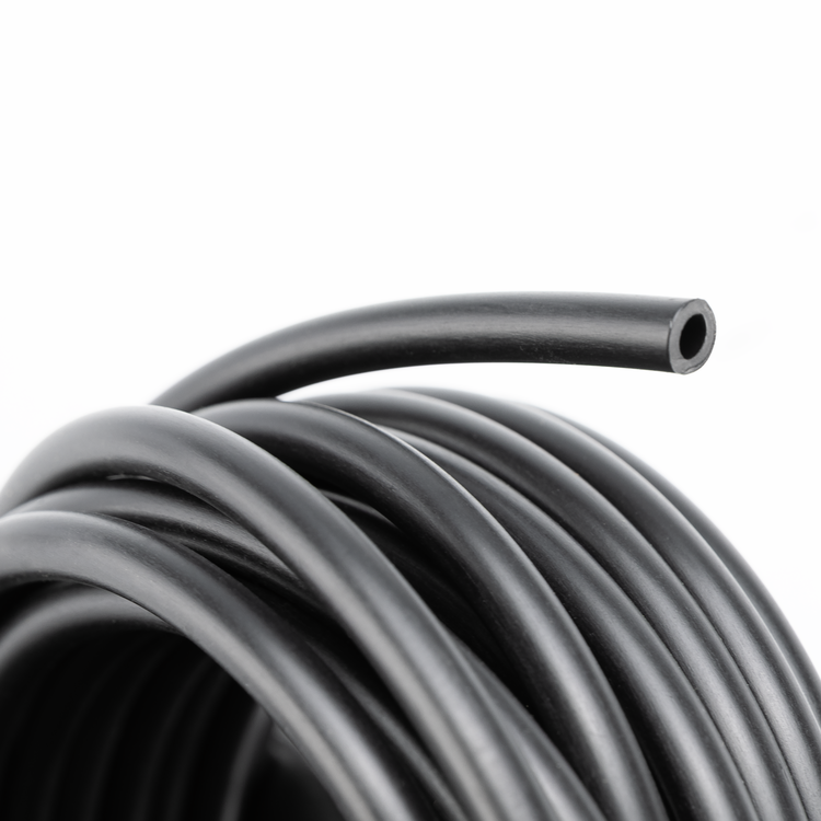 A close-up of a coiled black rubber or plastic tube with one end exposed, photographed on a plain white background.