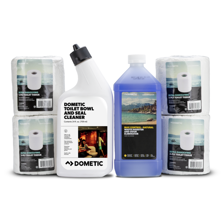 A Dometic toilet bowl and seal cleaner kit on a white background, featuring a white bottle of cleaner, a blue bottle of multi-purpose natural holding tank treatment, and four packs of Dometic toilet paper rolls.
