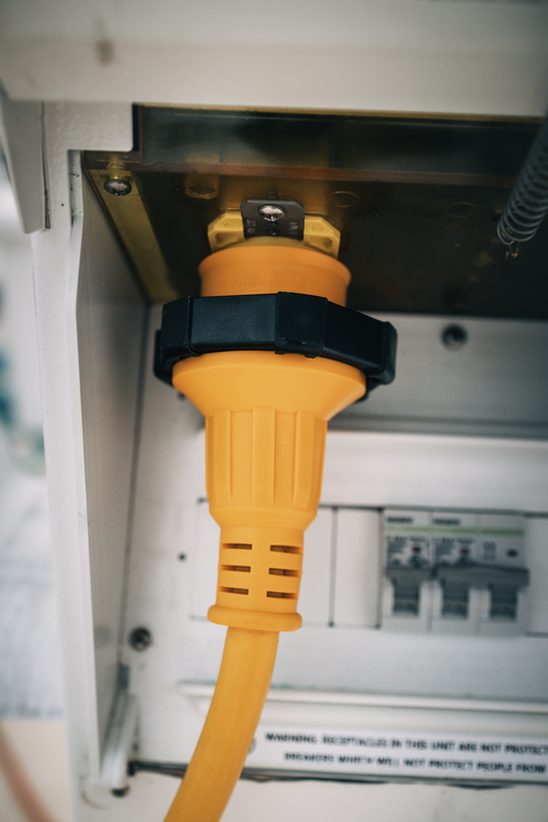 A Sierra shore power cordset plugged into a marina power port 