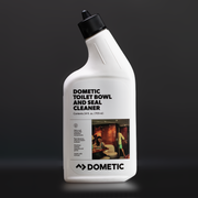 Dometic toilet bowl and seal cleaner bottle on a dark background