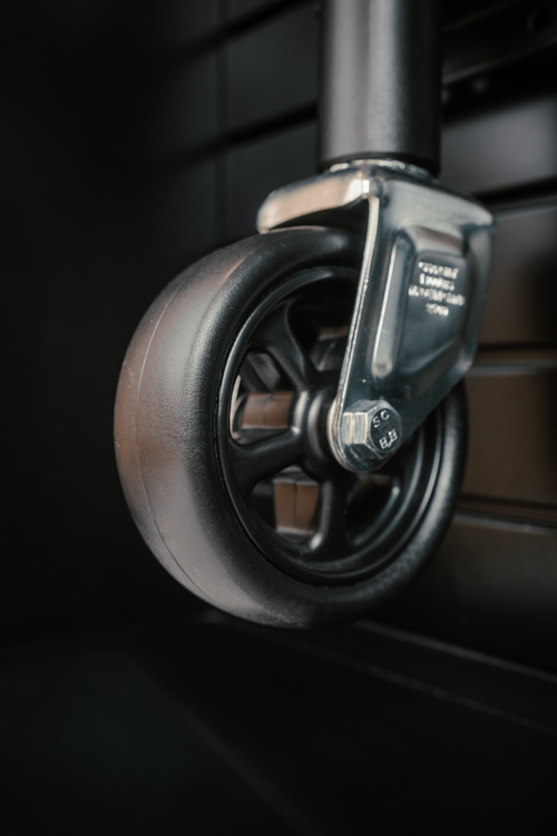 Close-up of a Sierra trailer jack wheel on a dark background