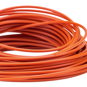 Coiled orange Prime Line trimmer line on a white background