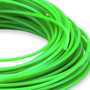 Coiled green prime line trimmer line on a white background