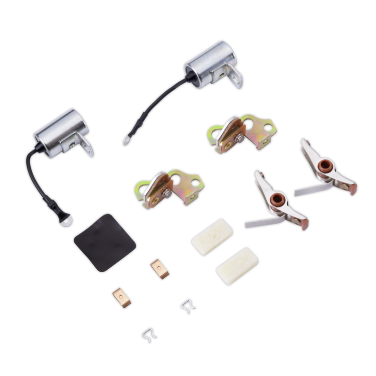 A tune up kit with two silver cylinders, four metal lock body components, two white rubber pads, a black rubber gasket, and small metal clips, arranged on a plain white background.