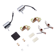 A tune up kit with hardware laid out on a white background, including two silver cylindrical units with black wires, two gold-toned metal clips, two silver-and-copper contact points, two small copper terminal pieces, two white rectangular pads, and a small black rubber pad.