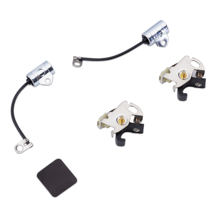 A set of four small metal hardware components with black wires and a square black rubber pad, photographed on a plain white background.