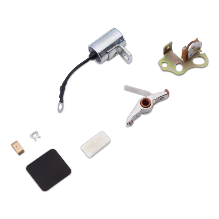 A set of small mechanical parts and accessories laid out on a white background, including a silver cylindrical component with a black wire, a gold-toned bracket, a metal hinge-like piece, a black rectangular pad, a white rectangular piece, and small hardware.