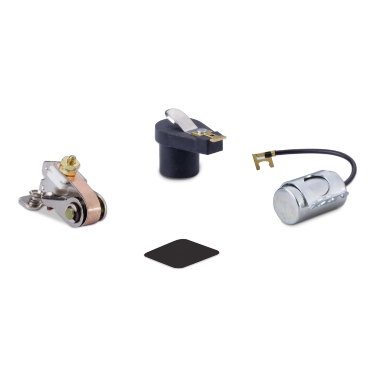 A set of four small mechanical/electrical components on a plain white background, including a metal contact-like part, a dark cylindrical component with a metal tab, a silver cylindrical component with a black wire and gold terminal, and a small black square piece.