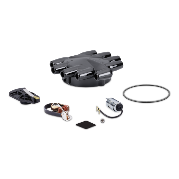 A black tune up kit laid out on a clean white background, including the main black coil base, a black ignition cover, a black ignition cable with a silver coil, a black gasket, a small metal screw, and a circular black rubber ring.