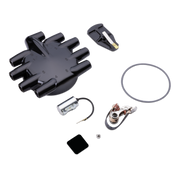 Tune up kit components, including a black distributor, a black ignition switch, a silver coil, a copper ignition switch, a black rubber gasket, and small mounting hardware, arranged on a plain white background.