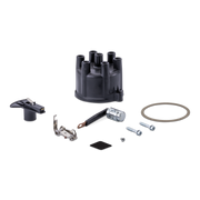 A black distributor cap kit with various metal and plastic components, including a spark plug coil, screws, and gasket arranged on a plain white background.