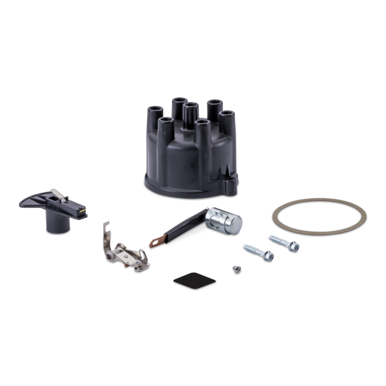 A black distributor cap kit with various metal and plastic components, including a spark plug coil, screws, and gasket arranged on a plain white background.