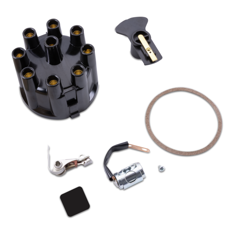 A set of black and silver mechanical components, including a distributor, ignition switch, gasket, and mounting hardware, arranged on a clean white background.