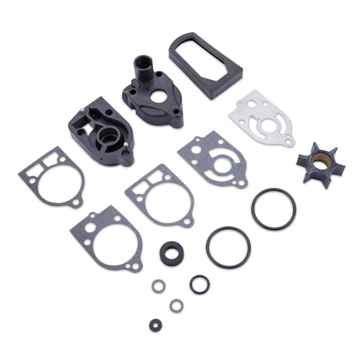 A set of gaskets and O-rings laid out on a white background, including black plastic and rubber components, metal gaskets, and a silver gasket.