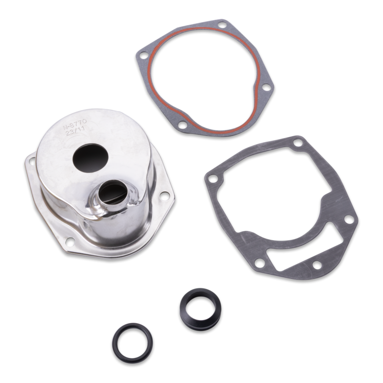 A metal engine gasket kit on a white background, including a polished silver aluminum component, two dark gray metal gaskets, and two black rubber O-rings.