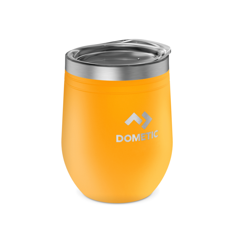 Orange insulated tumbler with silver lid on a white background, featuring Dometic logo.